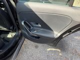 a car door open with the driver ' s side door open