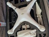 a white drone in a case with wires and other items