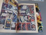a comic book open on a table with comics on it