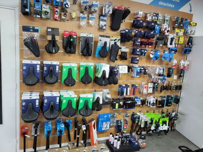 a wall with many different items on it in a store