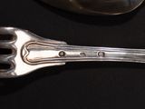 a fork and a spoon sitting on a table