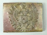a close up of a metal belt buckle with an eagle on it