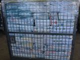 a cart full of bottles of water sitting in a warehouse