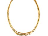 a gold and diamond necklace on a white background