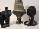 three vases that are sitting on a table