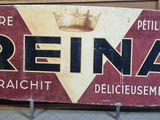 une pancarte sur laquelle est écrit « Reina » devant un mur de briques