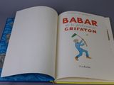 a book with a picture of a man swinging a golf club