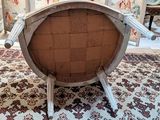 a chair that is sitting on a rug in a room