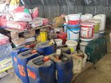 a pile of plastic containers and containers on a pallet