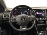 the interior of a car with a steering wheel and dashboard controls