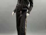 an image of a mannequin wearing a black and gold outfit