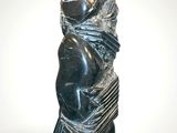 statue of a woman holding a baby in her arms