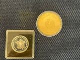 a gold coin and a silver coin sitting on a table
