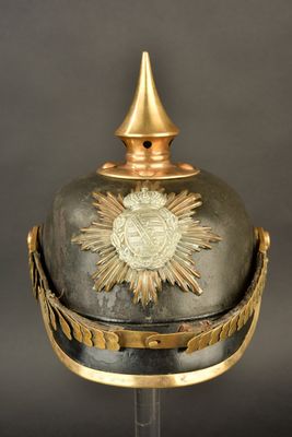 an old helmet with a gold star on the top of it