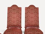 set of four red upholstered chairs with matching upholstered cushions