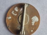 a small metal pin with a small metal pin on it