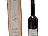 a bottle of wine that is next to a box