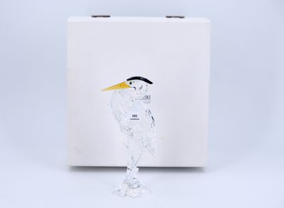 an image of a glass figurine of a bird with a yellow beak