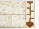 a picture of a tile with a spoon and a spoon rest on it