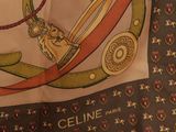 a close up of a scarf with a design on it