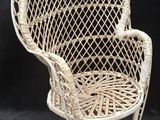 a close up of a wicker chair on a black background