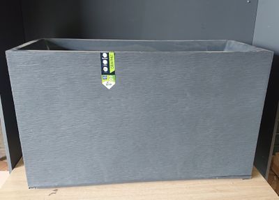 the box is on the table ready to be used as a planter