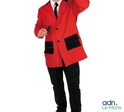 a man in a red jacket and black pants posing for a picture