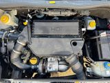 a picture of a car engine with its hood open