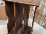 a small wooden table with a shelf on top of it