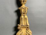 an image of a wooden candle holder on a gray background