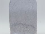 a white stone with a small hole in the middle of it