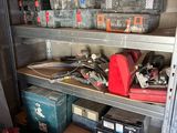 many boxes and tools on the shelves in the garage
