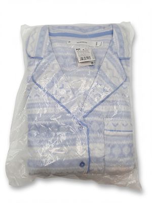the shirt is wrapped in plastic and ready to be worn