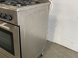 a stainless steel stove and oven in a room