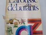 the book larousse de debutants is on a white surface