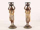 pair of antique bronze figurines of women carrying pots on their heads
