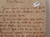 a piece of paper with writing on it sitting on a table