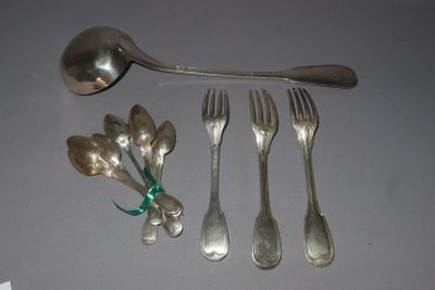 a spoon, fork, spoon and spoon rest next to each other