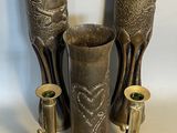 three vases sitting next to each other on a table