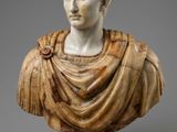 a marble bust of a man wearing a cloak