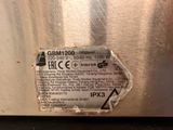 a label on the side of a stainless steel refrigerator