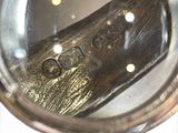 a close up of a metal object in a mirror