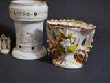 two vases that are next to each other on a table