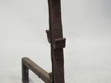 an old iron bench with a wooden seat on it