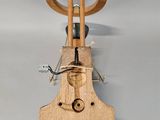 a wooden instrument that is hanging on the wall