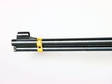 a close up of a camera tripod on a white surface