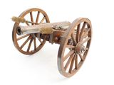 un canon posé sur une roue en bois