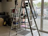 a ladder that is sitting in the middle of a room