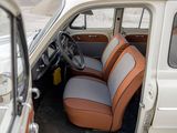 a small car with two seats and a steering wheel