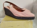 pair of women ' s shoes on top of a box on a white surface